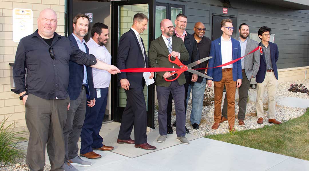 Photo of Bay City lofts ribbon cutting ceremony.